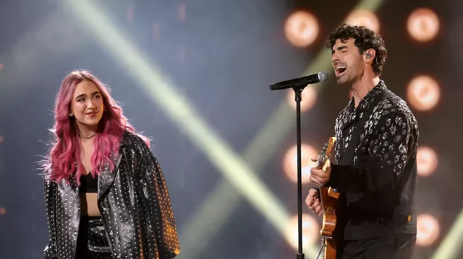 Joe Jonas and Ela Taubert onstage at the Latin Grammys in Miami