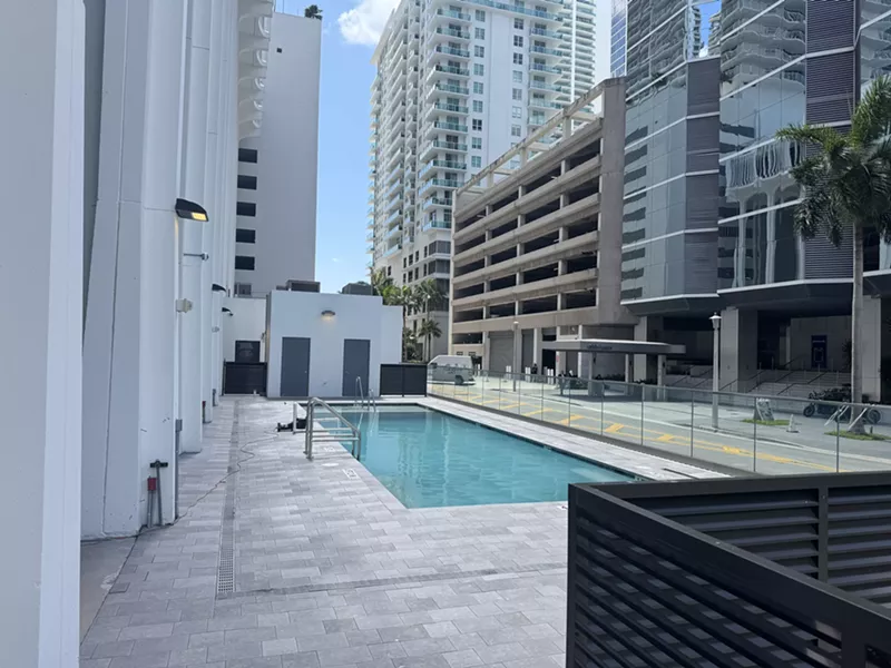 Image: A ground-level pool next to CVS in Brickell