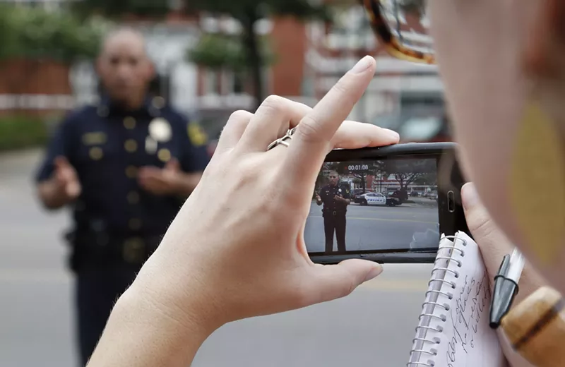Image: A new proposed Florida law would make it a crime to record video of police officers from less than 30 feet away.
