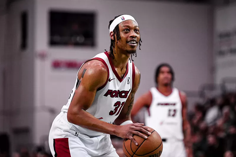 Image: photo of a basketball player preparing to shoot