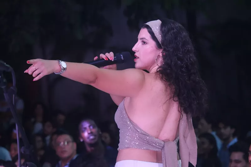 Image: Woman with a bandana and a microphone