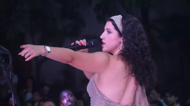 Woman with a bandana and a microphone
