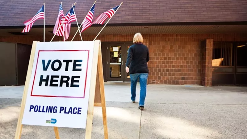 Image: person at a voting station
