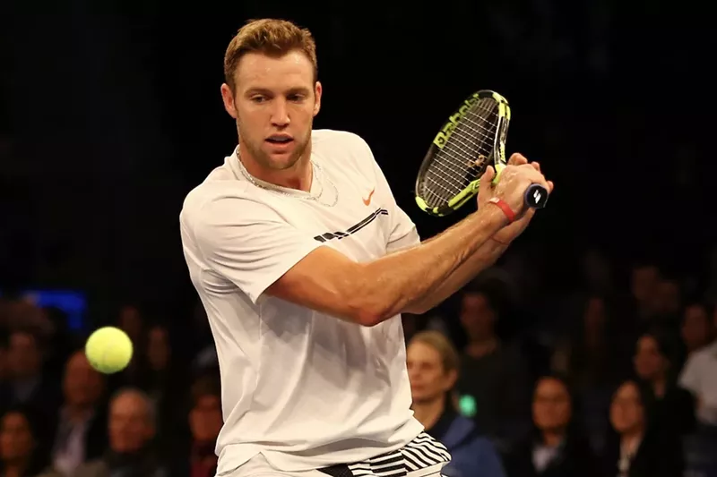 Image: Jack Sock holding a pickleball racquet