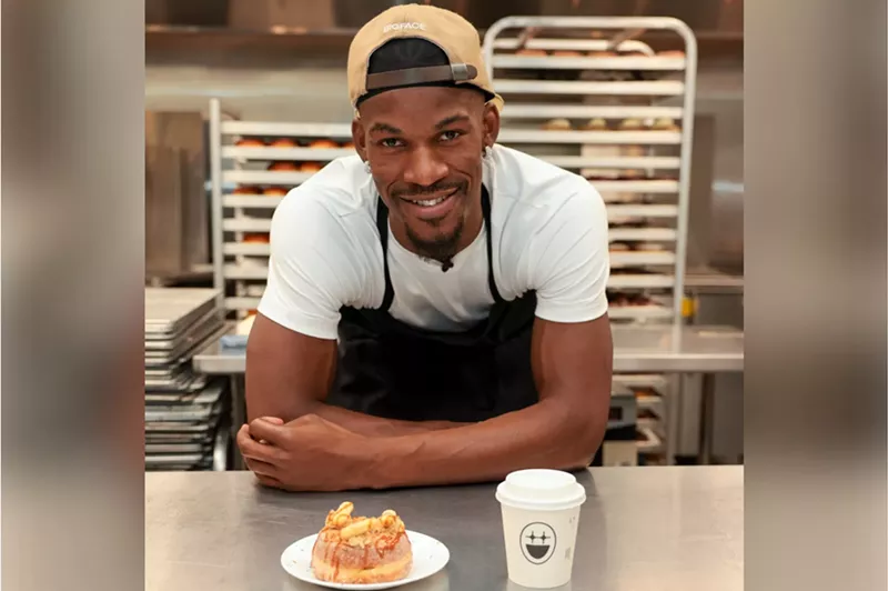 Image: A man posing with a doughnut