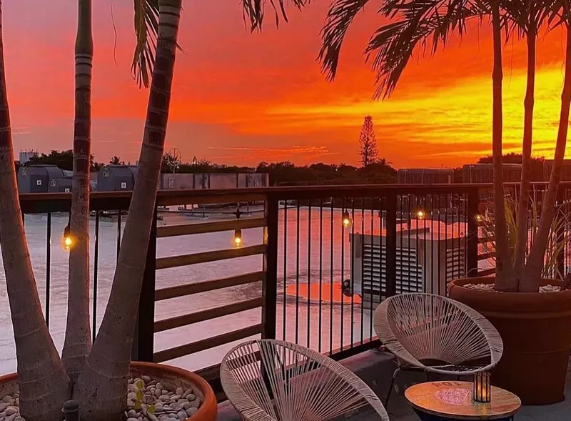 Image: A sunset over a balcony