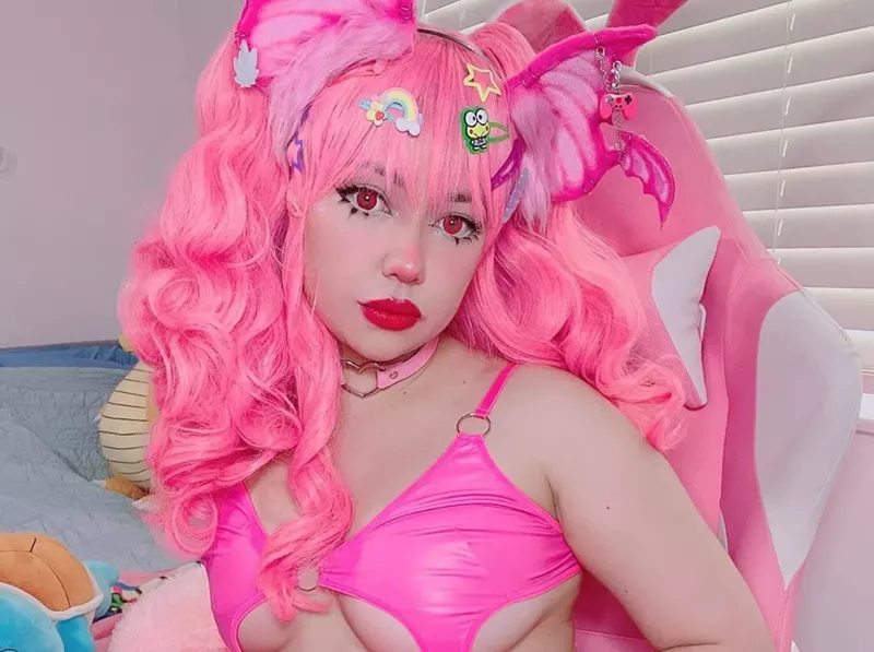 Image: Kirbii Casablancas in a pink wig and pink bikini top
