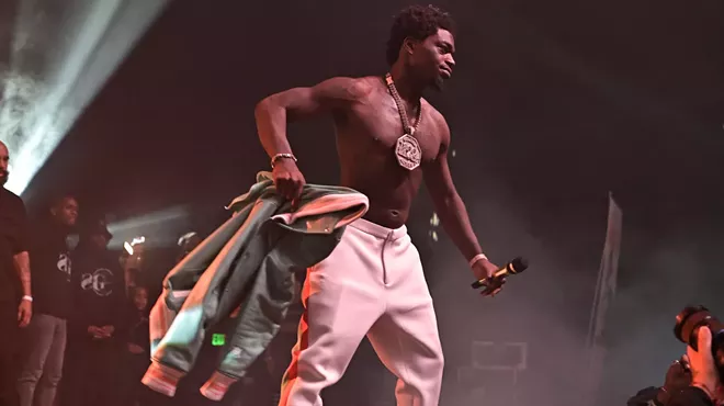 New Times file photo of Kodak Black performing shirtless, onstage