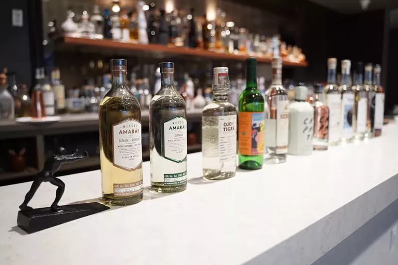 Image: bottles of mezcal on a table