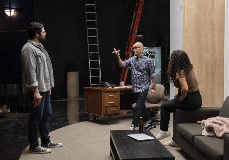 Director Teo Castellanos works with actors Alex Alvarez and Alexandra Acosta during a Fade rehearsal