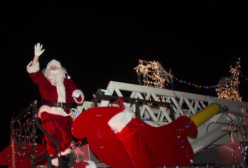 Volunteer Santa James Silverstone waves to a crowd during Lauderdale-by-the-Sea's 2016 Christmas celebration.