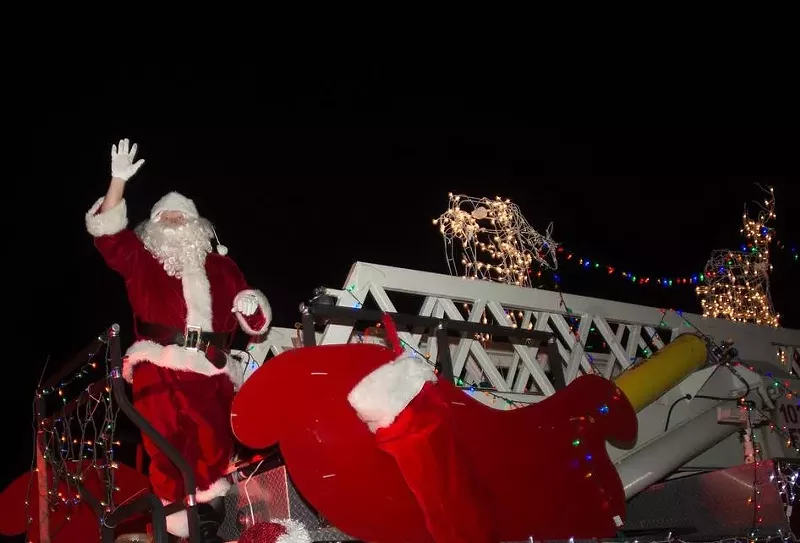 Image: Volunteer Santa James Silverstone waves to a crowd during Lauderdale-by-the-Sea's 2016 Christmas celebration.