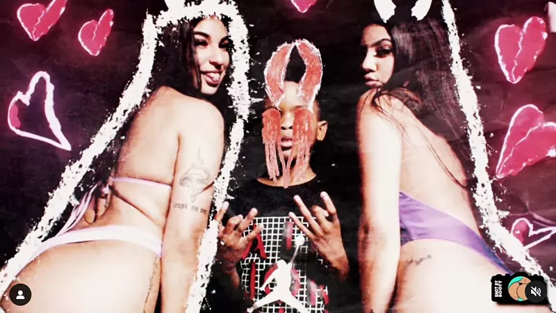 Image: Nine-year-old rapper Lil RT with devil horns super-imposed on his head, next to two dancers in thongs