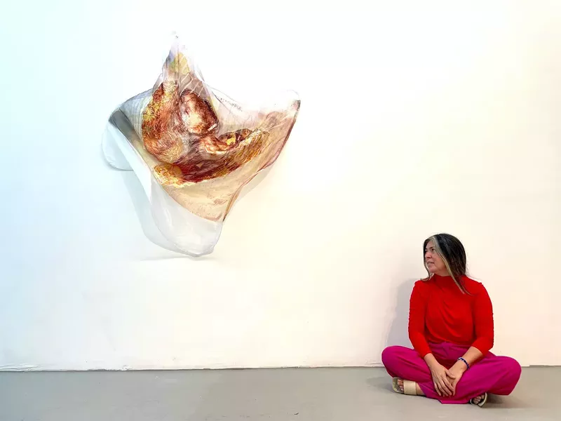 Image: Vega at her solo exhibition in Wynwood's Edge Zones Contemporary Art gallery.
