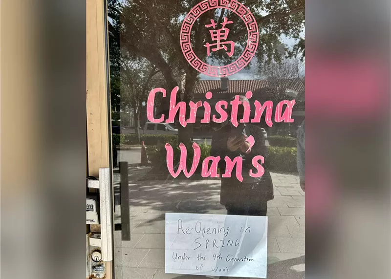 Image: a glass door with red letters