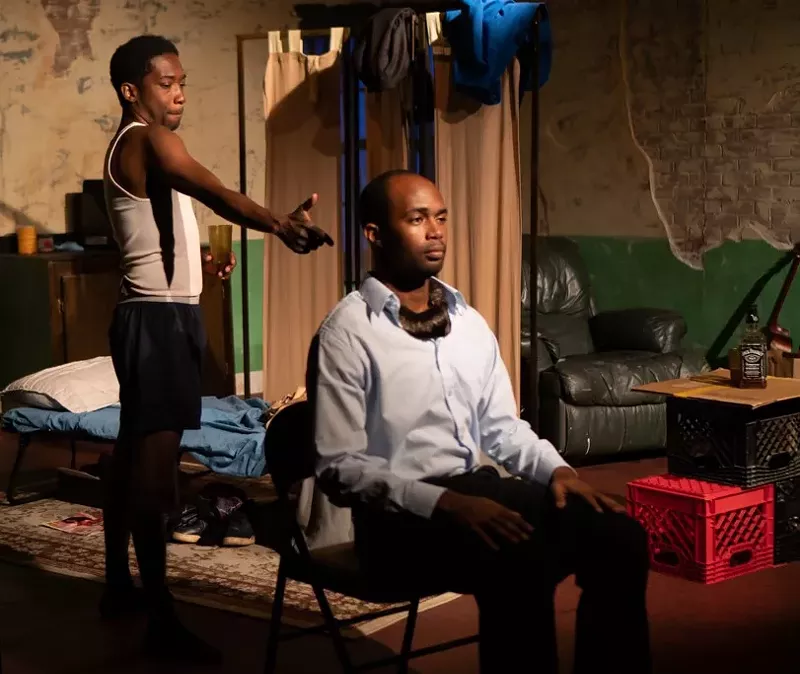 Image: Roderick Randle as Booth and Denzel McCausland as his brother Lincoln in Topdog/Underdog at Main Street Playhouse.
