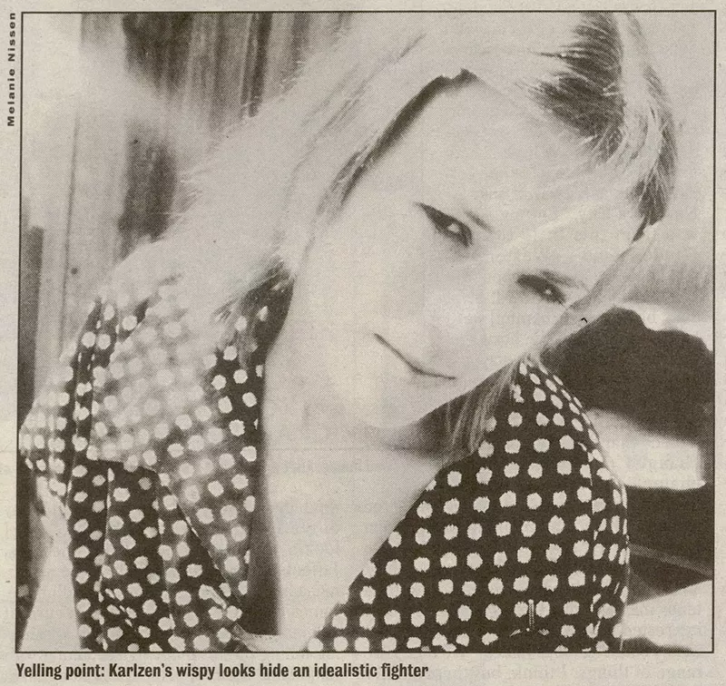 Image: black and white close-up portrait of a woman, printed in a newspaper