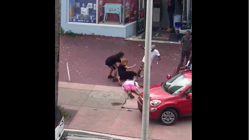 An incapacitated man is kicked in the head outside I Love Liquor on Collins Avenue.