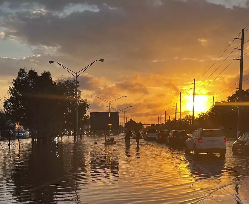Image: The sun rises over waterlogged Broward County after a night of historic rain.