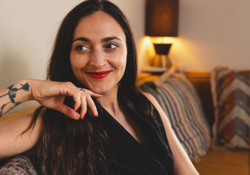 Image: Headshot of a journalist smiling