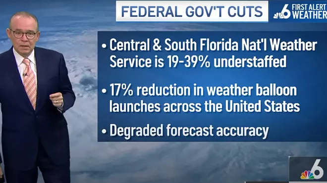 John Morales stands during his newscast with a graphic about the federal government cuts to climate research