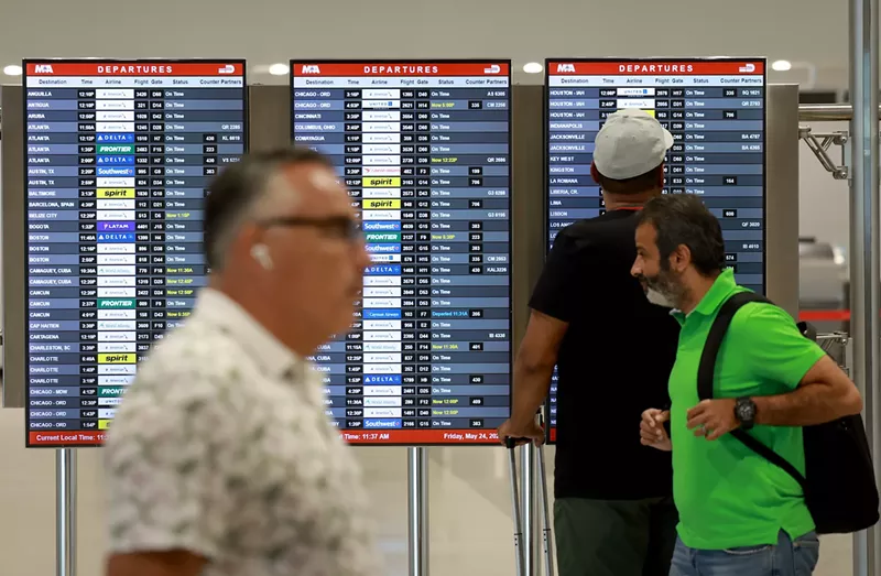 Image: The departure board at Miami International Airport