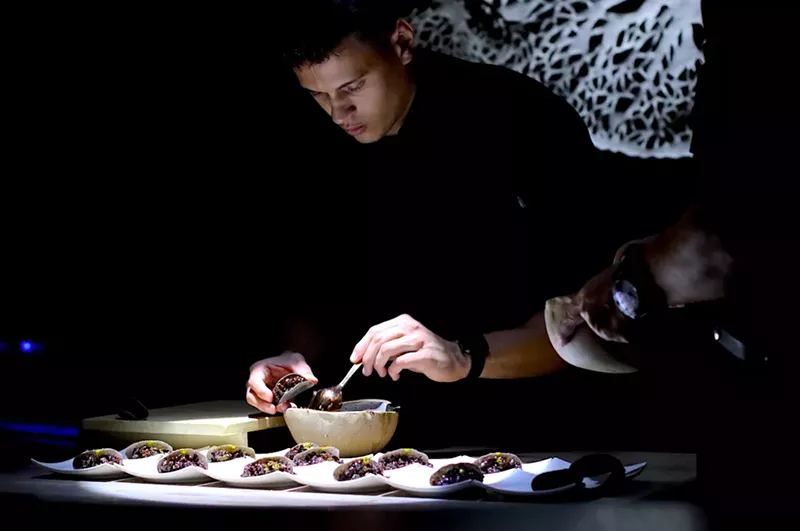 Image: Nossa Omakase sous chef Gino Isola sets up an intricate dish.
