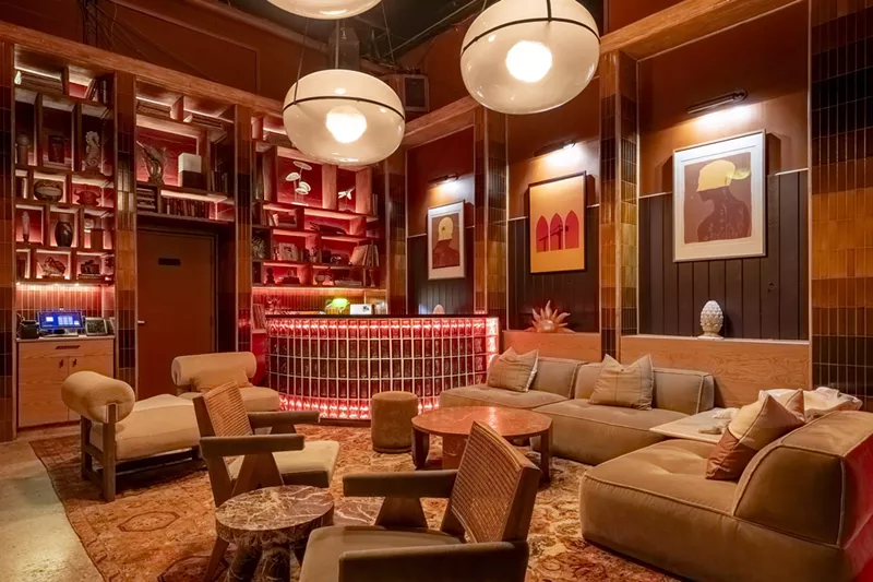 Image: A red dining room area with chairs