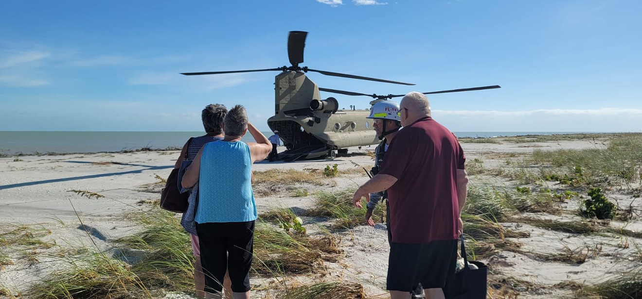 Members of Florida Task Force 1 rescue stranded residents from barrier islands on Florida's west coast on September 29, 2022, after the region was decimated by Hurricane Ian's storm surge.