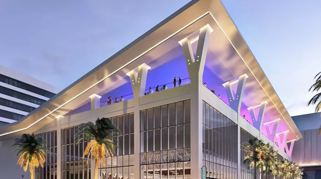 a giant building with a rooftop restaurant
