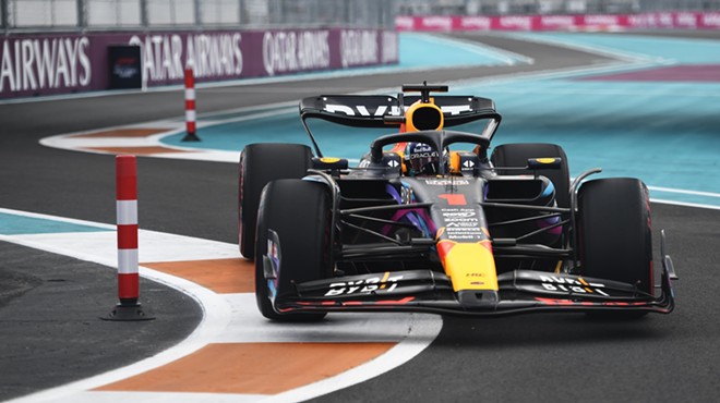 Max Verstappen in his car racing on the track