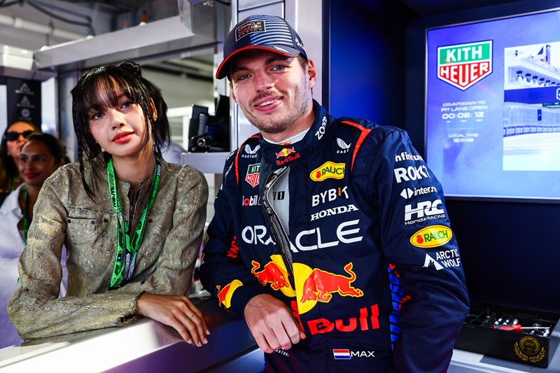 Lisa from Blackpink poses with Dutch driver Max Verstappen during her visit to the Oracle Red Bull Racing prior to the Miami Grand Prix.