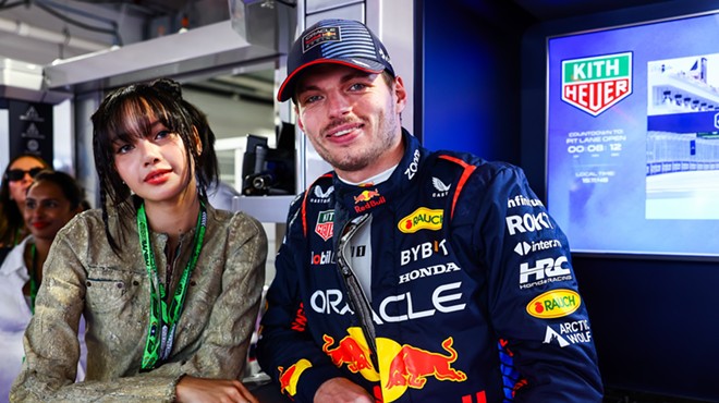 Lisa from Blackpink posing with Dutch driver Max Verstappen at Miami Grand Prix