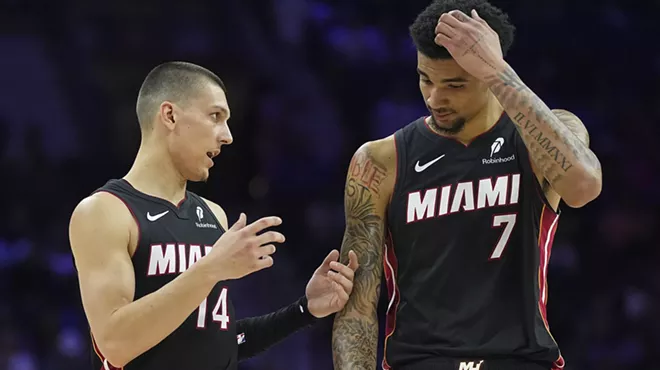 Tyler Herro #14 of the Miami Heat talks to Kel'el Ware #7 against the Philadelphia 76ers in the first half at the Wells Fargo Center on March 29, 2025, in Philadelphia, Pennsylvania.
