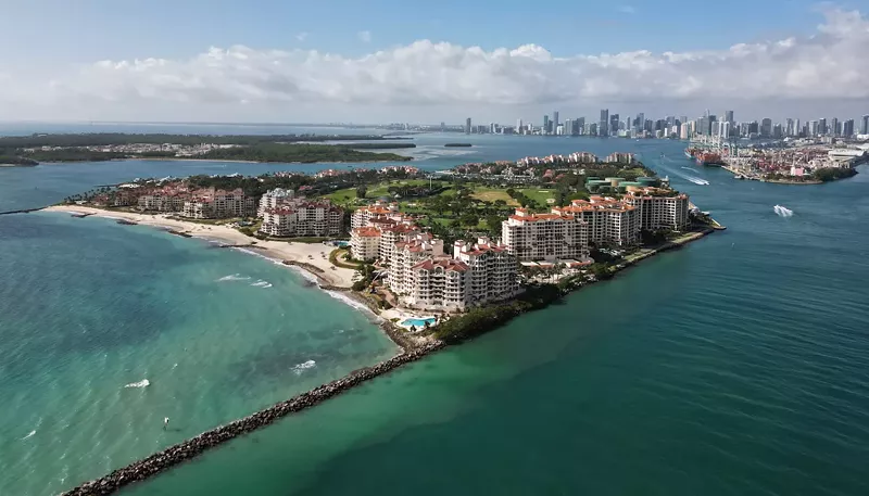 Image: Panorama aerial drone view of Fisher island, with Miami Beach in the background