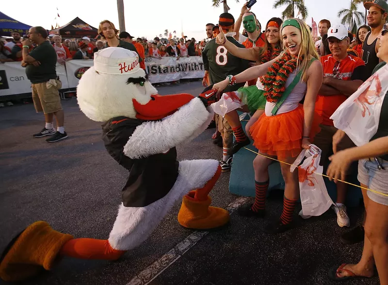 Image: Sebastian the Ibis, the Miami Hurricanes mascot, proposes to a fan outside Sun Life Stadium prior to the game against the Florida State Seminoles on November 15, 2014 in Miami Gardens, Florida.