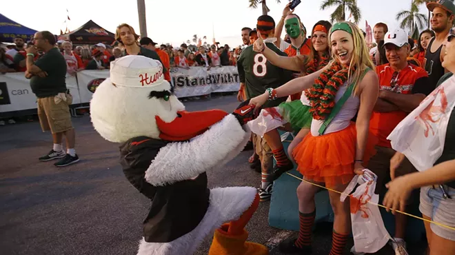 Sebastian the Ibis, the Miami Hurricanes mascot, proposes to a fan outside Sun Life Stadium prior to the game against the Florida State Seminoles on November 15, 2014 in Miami Gardens, Florida.