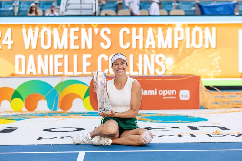 Image: Danielle Collins holding her trophy at the Miami Open