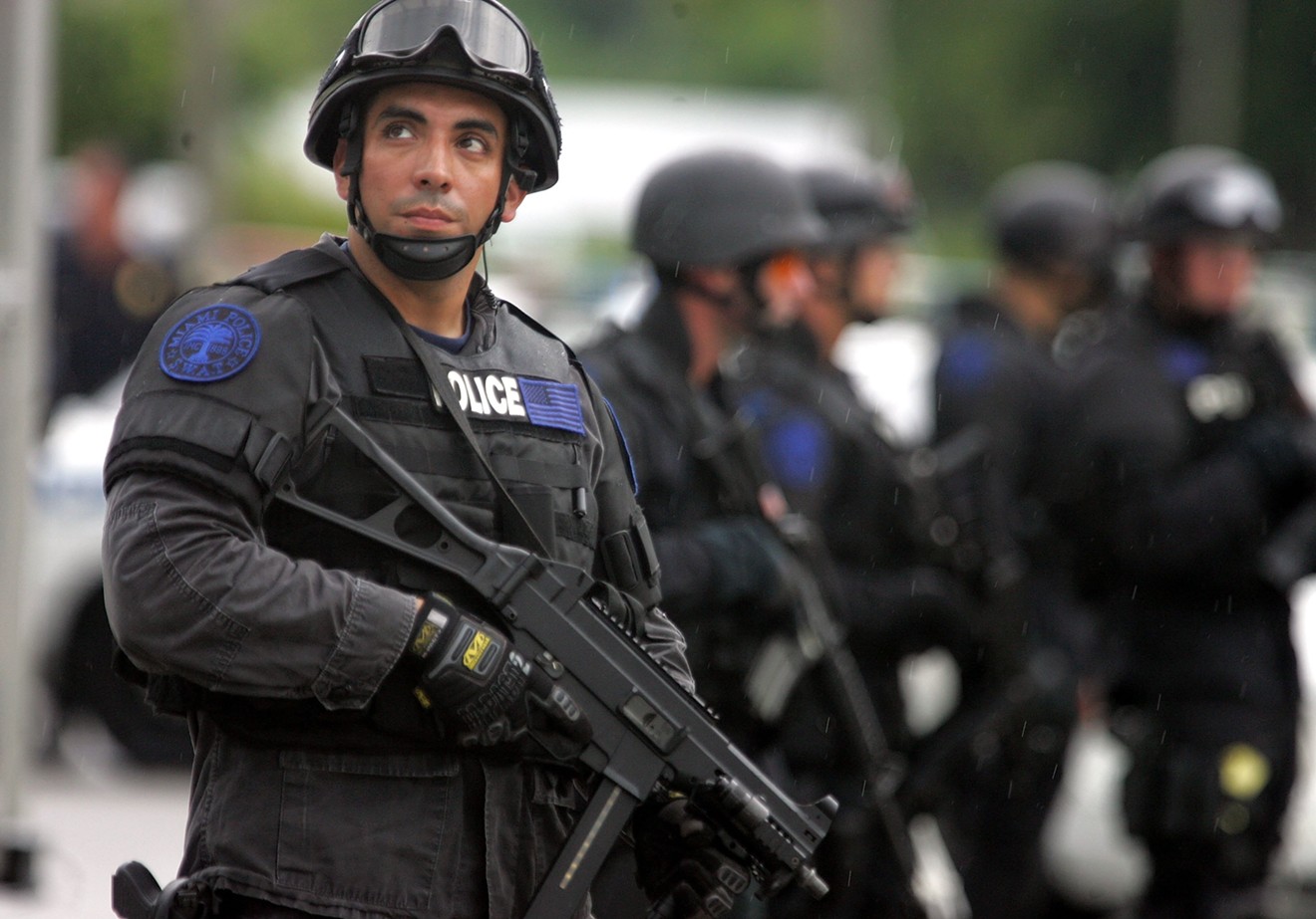 A Miami Police Department SWAT team member on the scene of a drug raid in Liberty City in 2006.