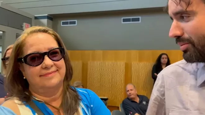 Beba Sardiña Mann looks at the camera next to Thomas Kennedy