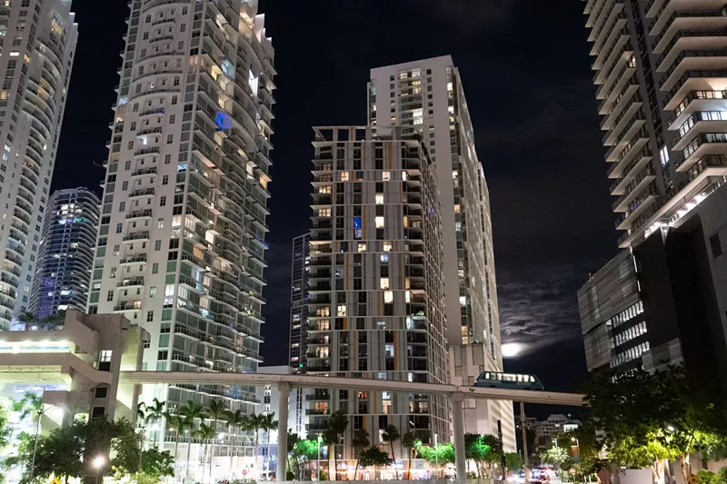 Image: Brickell skyline by night with Metromover crossing bridge in the foreground