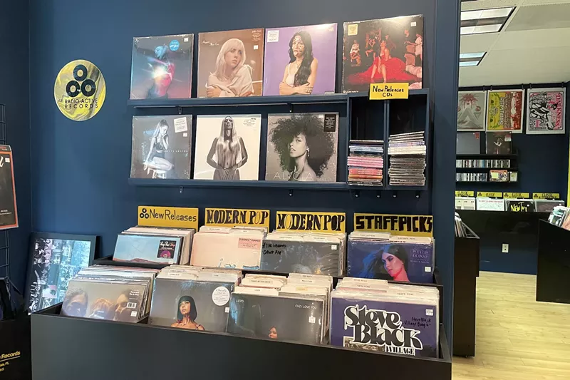 Image: The wall and bin of new vinyl albums at Radio-Active Records