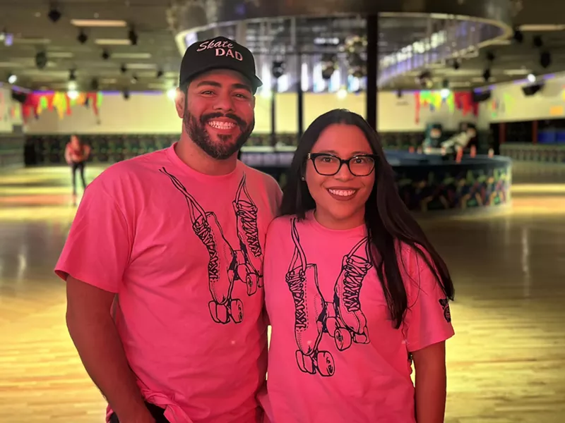 Image: Miami Roller Rink owners Gabe Colon and Pam Mostacero standing in front of the roller rink