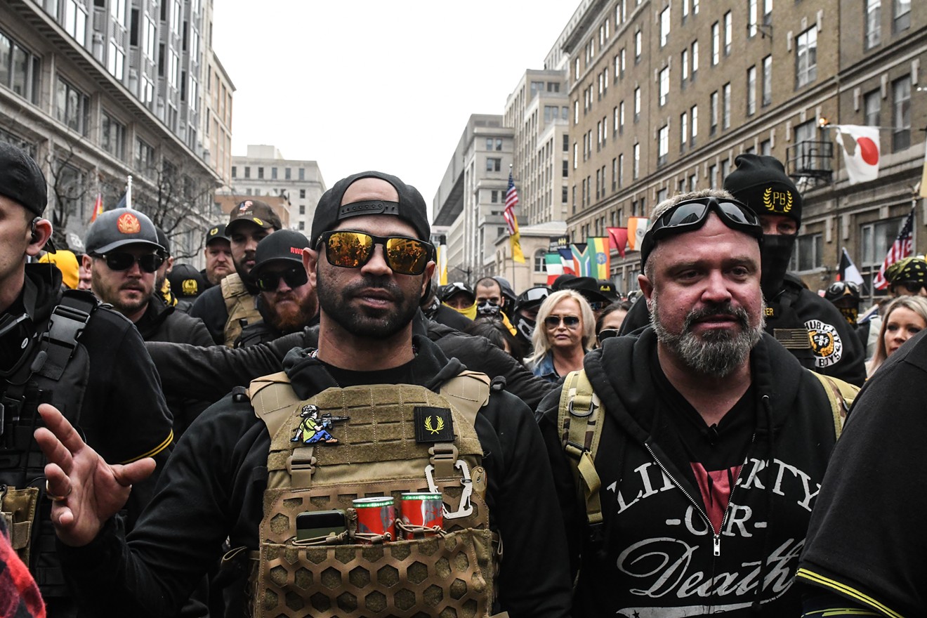 Enrique Tarrio (left), leader of the Proud Boys, and Joe Biggs gather outside of Harry's bar during a protest on December 12, 2020 in Washington, DC.