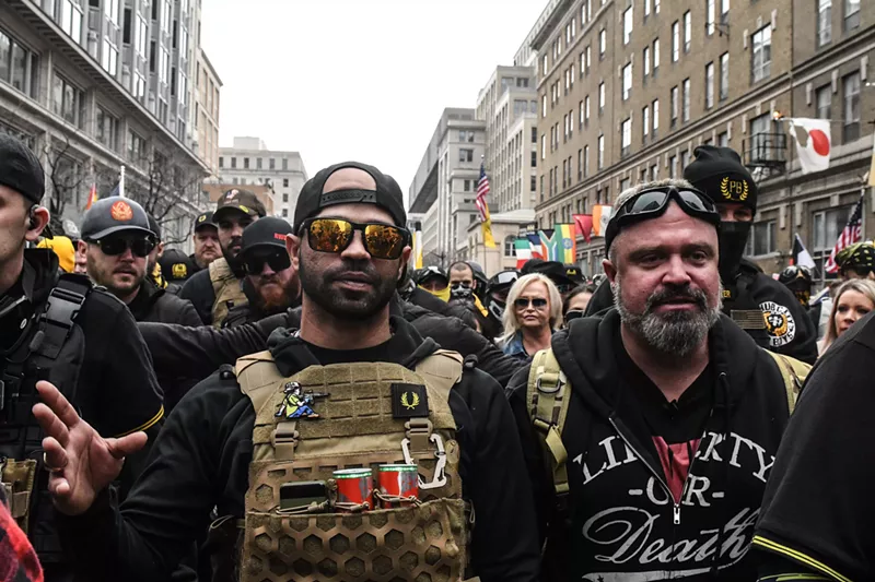 Image: Enrique Tarrio (left), leader of the Proud Boys, and Joe Biggs gather outside of Harry's bar during a protest on December 12, 2020 in Washington, DC.
