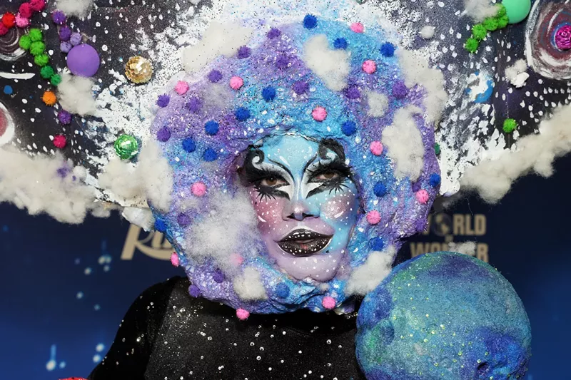 Image: close-up of drag performer Lucky Starzzz in face paint and wig