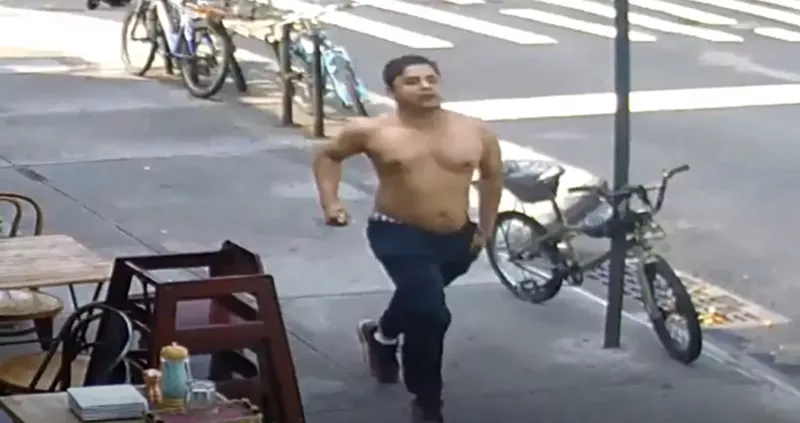 Image: A shirtless man runs desperately through the streets of New York City