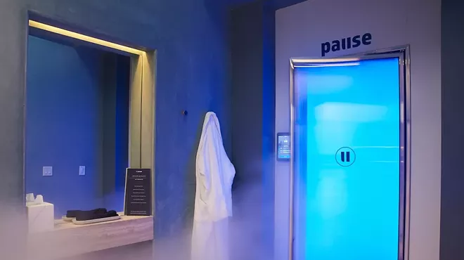 a steamy treatment room with blue lighting inside a spa