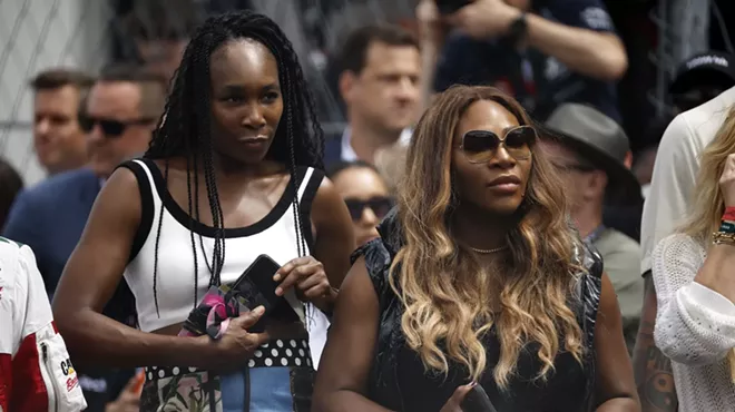 Venus Williams and Serena Williams watch the grid presentation prior to the F1 Grand Prix of Miami at Miami International Autodrome on May 07, 2023 in Miami, Florida