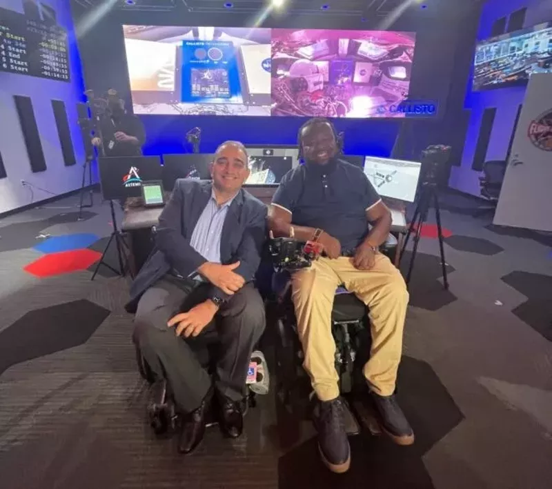 Image: Miami podcaster Rhonel Cinous (r) and Vincenzo Piscopo, CEO of United Spinal Association, at the Johnson Space Center in Houston.